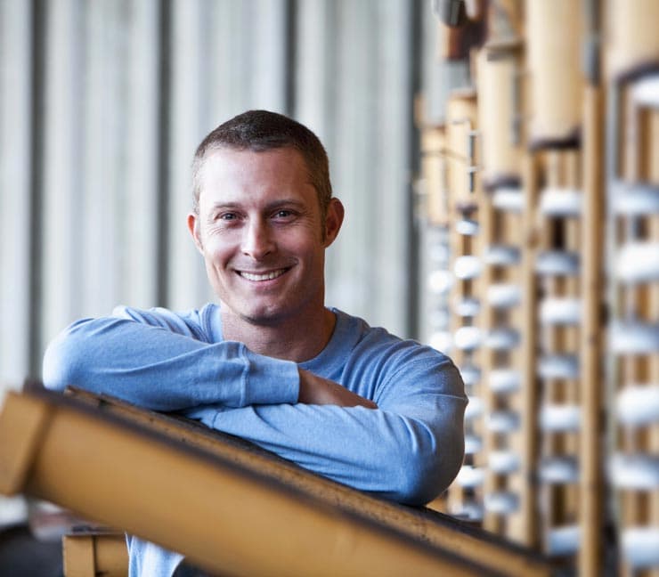 Smiling agricultural producer
